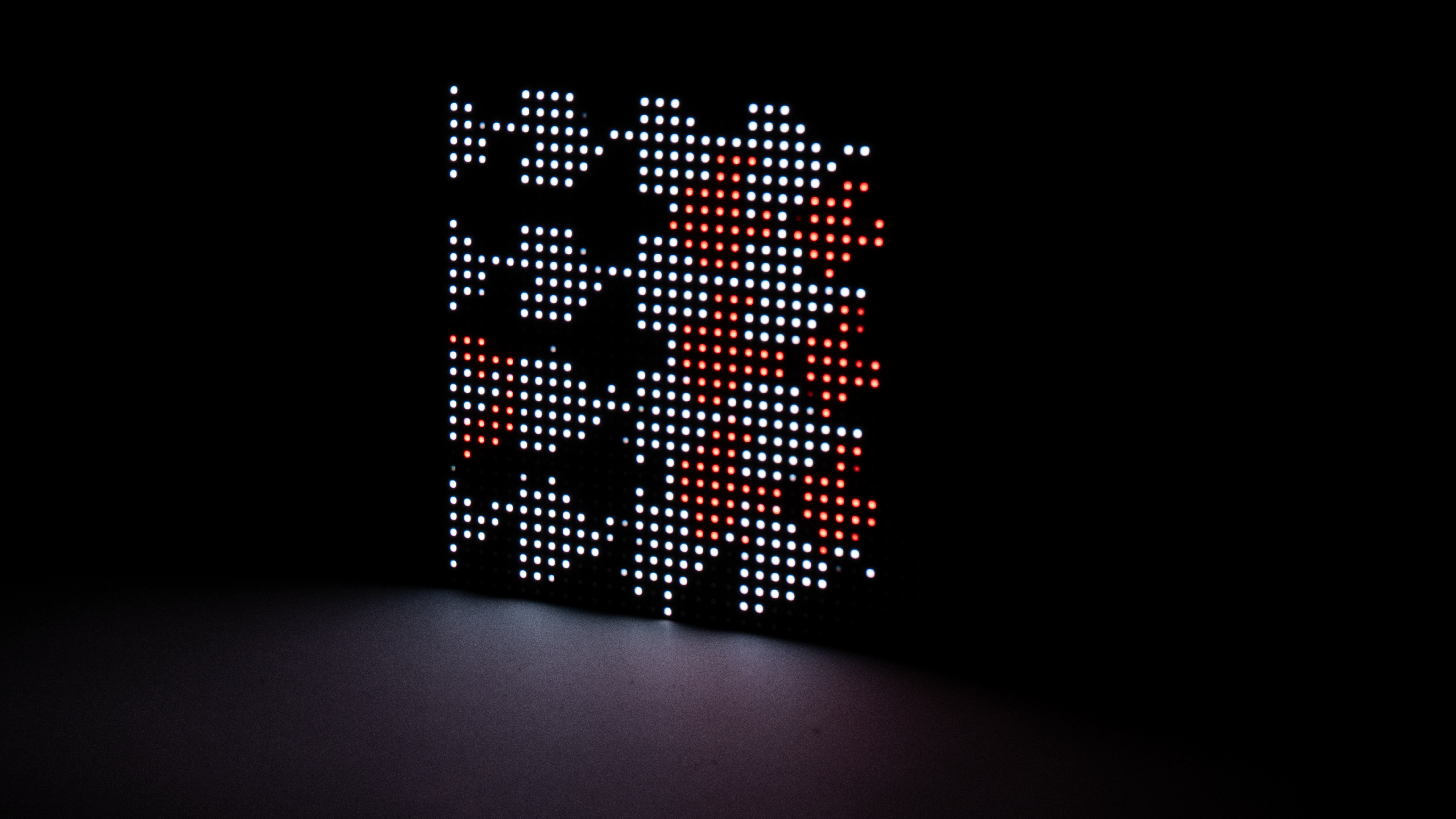 LED matrix showing transforming arrow patterns in white and red